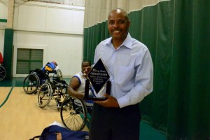 Coach Jackson with the Norco Rolling Devils Wheelchair Basketball Tournament 2014 Championship Trophy